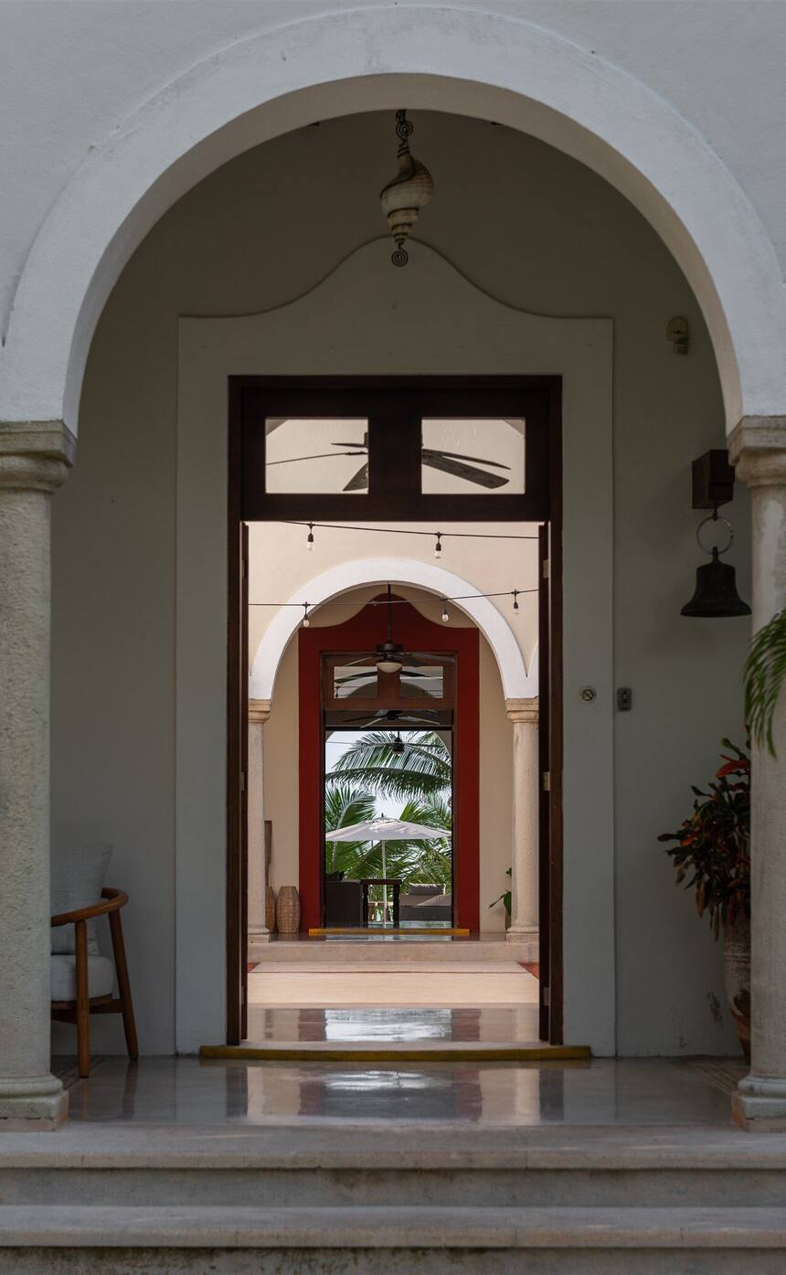 The front door of Hacienda Del Mar under its arch, looking through the house to the courtyard and the sea