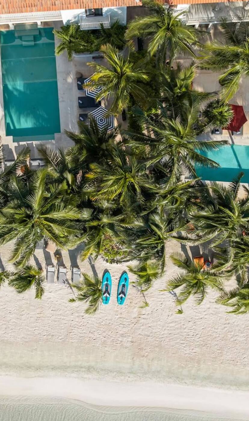 The four haciendas from above: four pools, palms and the beach